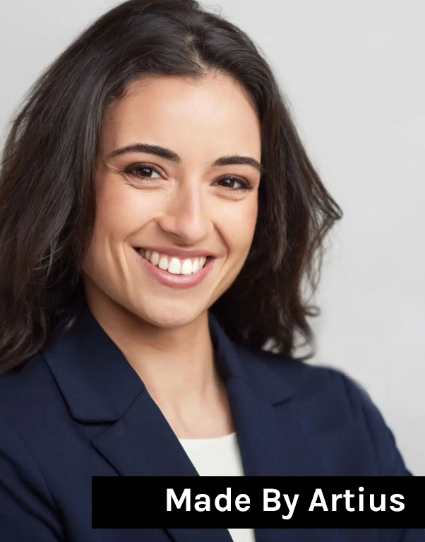 A corporate headshot with a clean and neutral background, allowing the subject's face to stand out